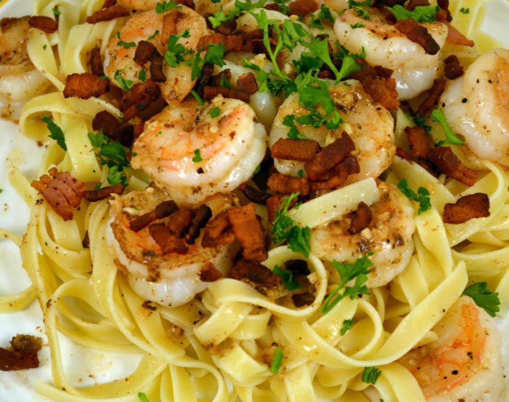 Tagliatelle met scampi en spek